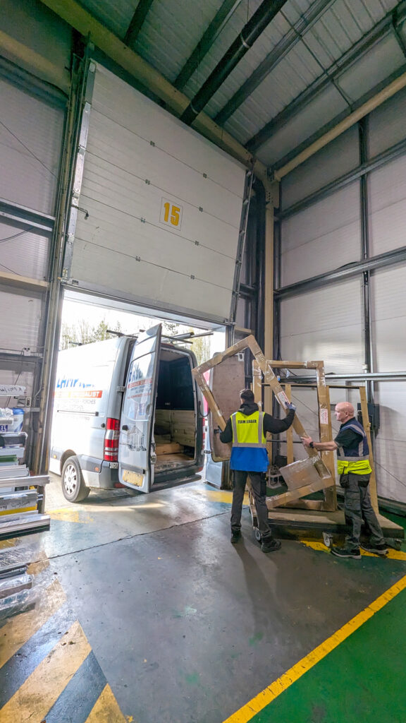 Two Made for Trade staff loading a van with bi-fold doors using Kwikcollect service.