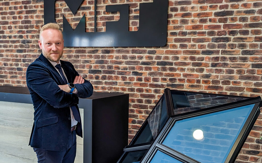 Close-up of Bradley Gaunt, Managing Director of Made For Trade, standing next to a Korniche Roof Lantern